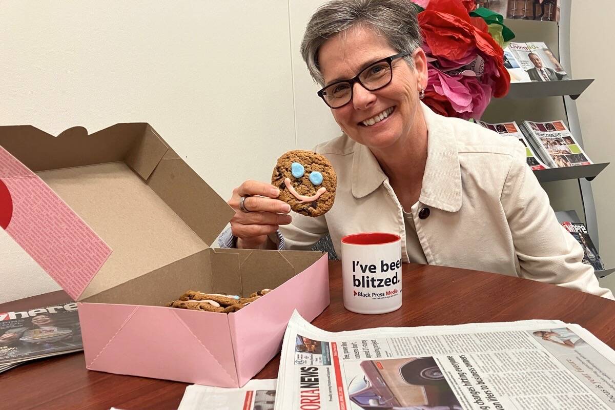 Veronica Carroll, CEO of the Children’s Health Foundation of Vancouver Island, picks a smile cookie to kick off the smile cookie campaign at Tim Hortons. The campaign, which runs May 1 to 7, has raised $362,585 for the foundation in the last nine years. (Christine van Reeuwyk/News Staff)