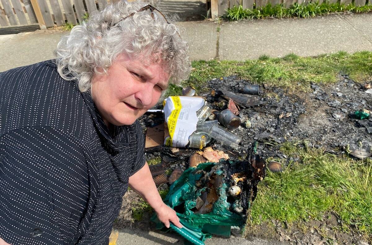 After having her green bin and recycling set ablaze early Tuesday morning, finding out that the onus to remove the burnt remains and purchase a new green bin leaves longtime Vista Street resident Debbie Marc, fuming, and fired up. (Chadd Cawson/Citizen)