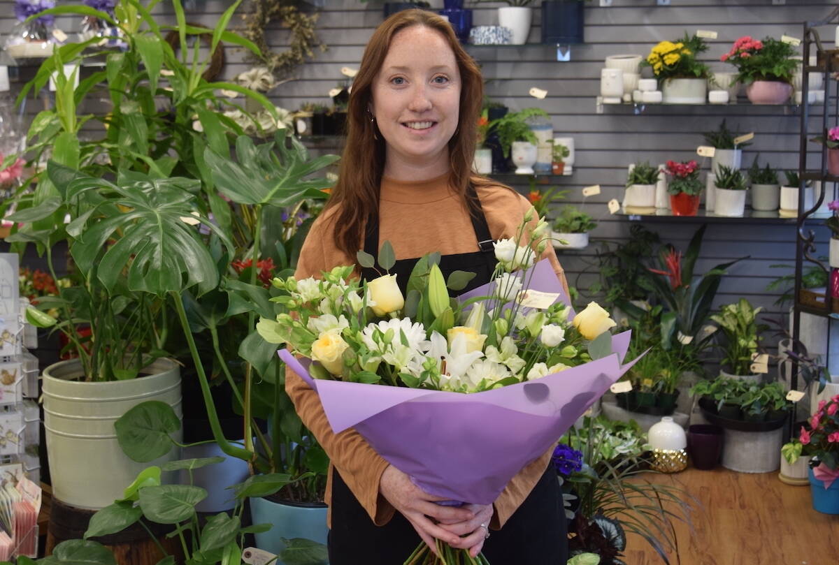 Jennifer Loewe, a floral designer at Brown’s The Florist in Sidney, is getting ready for Mother’s Day. (Brendan Mayer/News Staff)