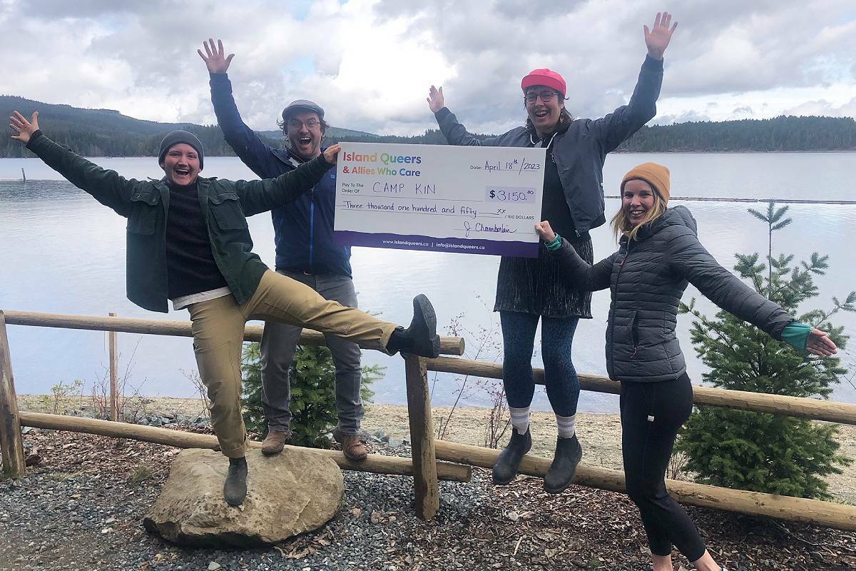 Tem McCutcheon, left, Stuart Biggs, Meika Johnson, and Genevieve Burdett accept a donation of $3,150 from Island Queers and Allies Who Care on behalf of Lake Park Society’s Camp Kin program in Cumberland. (Submitted photo)