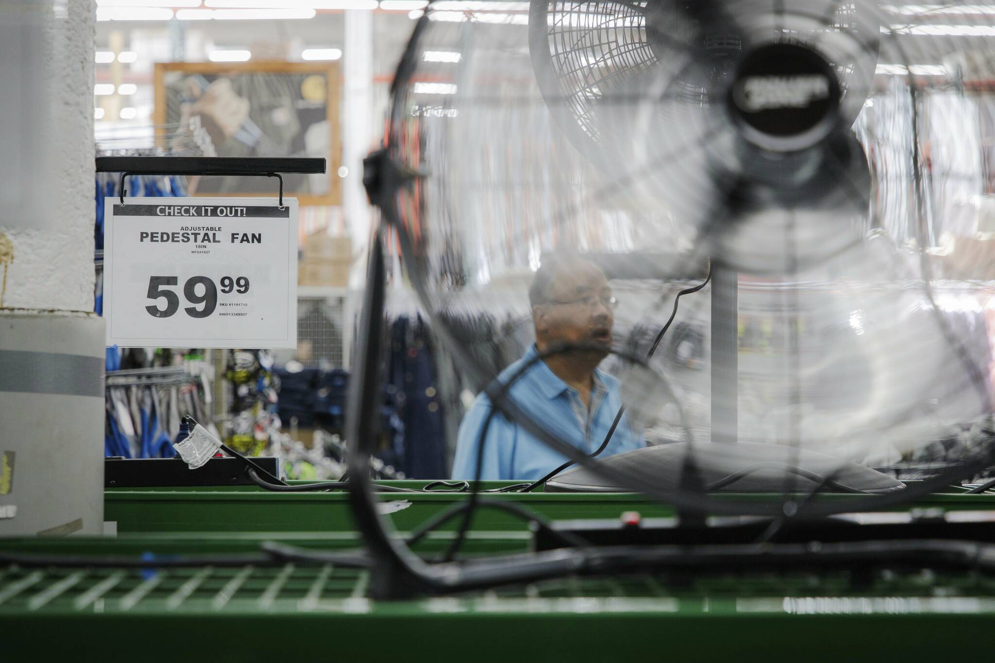 Stacks of air conditioners, fans and other cooling equipment line the entrance of McLendon Hardware in Renton, Wash., on Sunday, July 24, 2022. British Columbia is preparing for its first heat wave of the year starting Friday, May 12 to Wednesday, May 17, 2023. (Kori Suzuki/The Seattle Times via AP)
