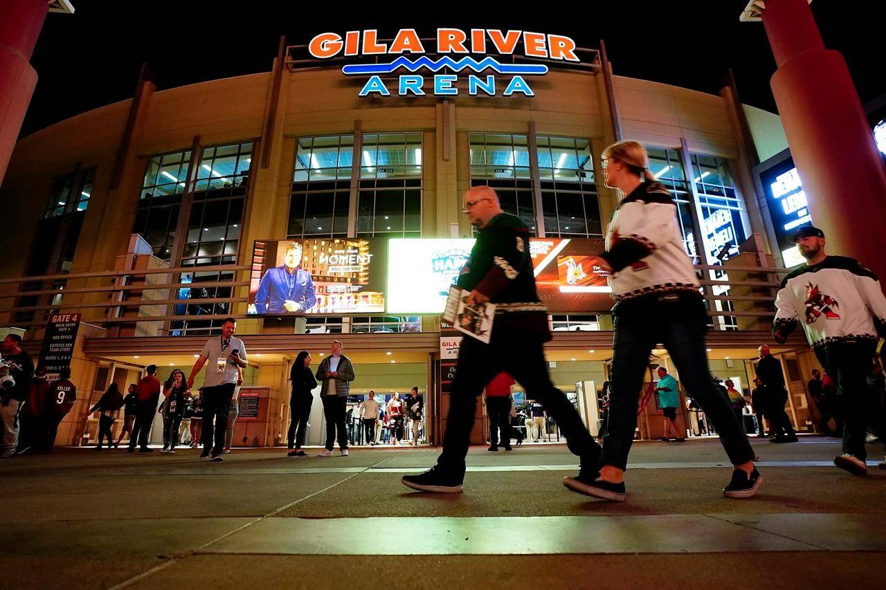 Arizona Coyotes fans leave the Gila River Arena after an NHL hockey game between the Coyotes and the Nashville Predators Friday, April 29, 2022, in Glendale, Ariz., the team’s final game at the facility. THE CANADIAN PRESS/AP /Ross D. Franklin
