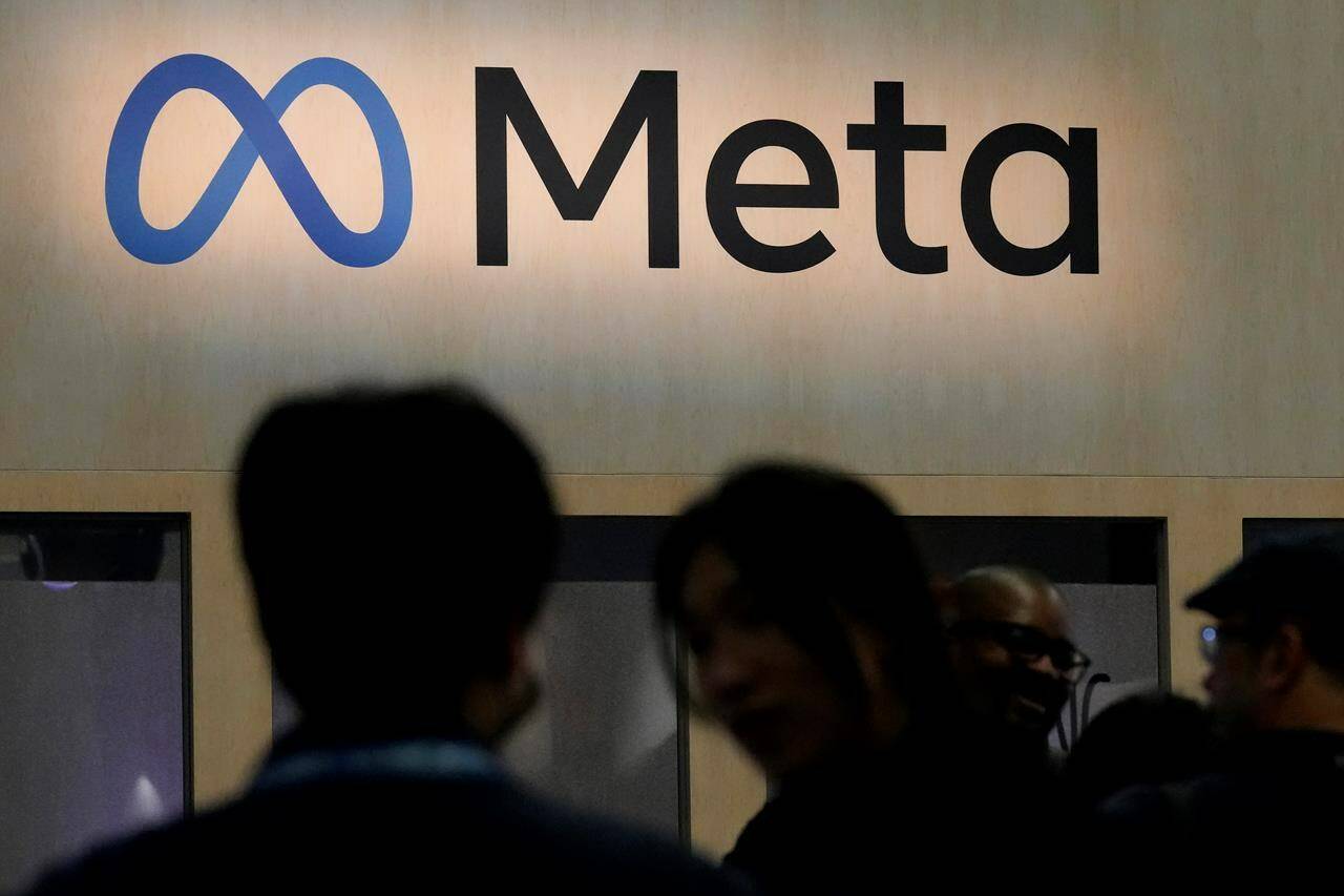 FILE - Attendees visit the Meta booth at the Game Developers Conference 2023 in San Francisco, Wednesday, March 22, 2023. European Union hits Facebook parent Meta with record $1.3 billion fine over transfers of user data to US. (AP Photo/Jeff Chiu, File)