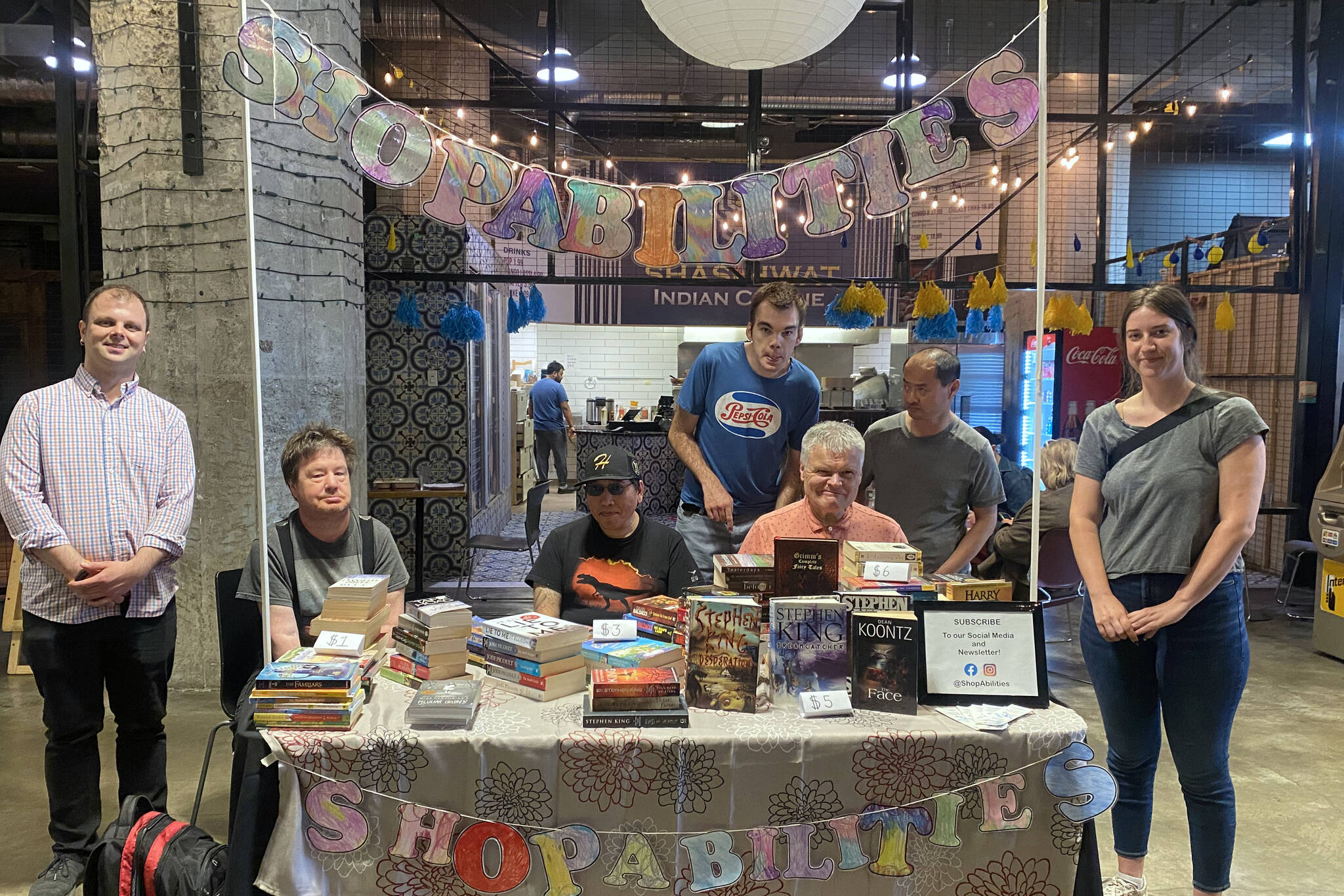 ShopAbilities at the Victoria Public Market at the Hudson selling their used books and goods. (Ella Matte/News Staff)