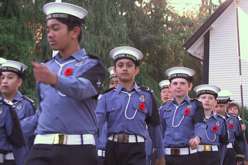 Cadets march into the candlelight tribute at Esquimalt, God’s Acre veterans cemetery. (Ella Matte/News Staff)