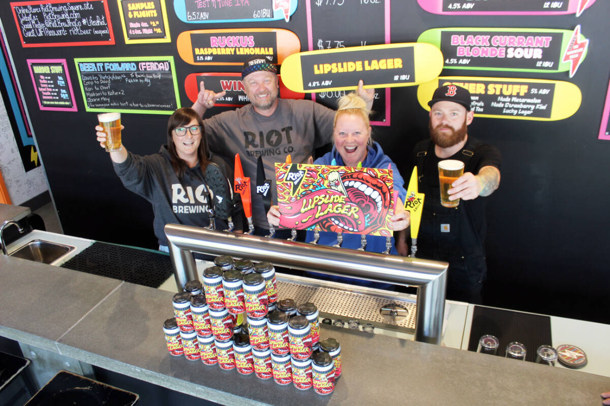 Riot Brewing crew celebrates another award from the Canadian Brewing Awards, with Lipslide Lager landing a bronze. From left: manager Shay Kuhnert, co-owners Ralf Rosenke and Aly Tomlin and head brewer Jesse Grass. (Photo by Don Bodger)