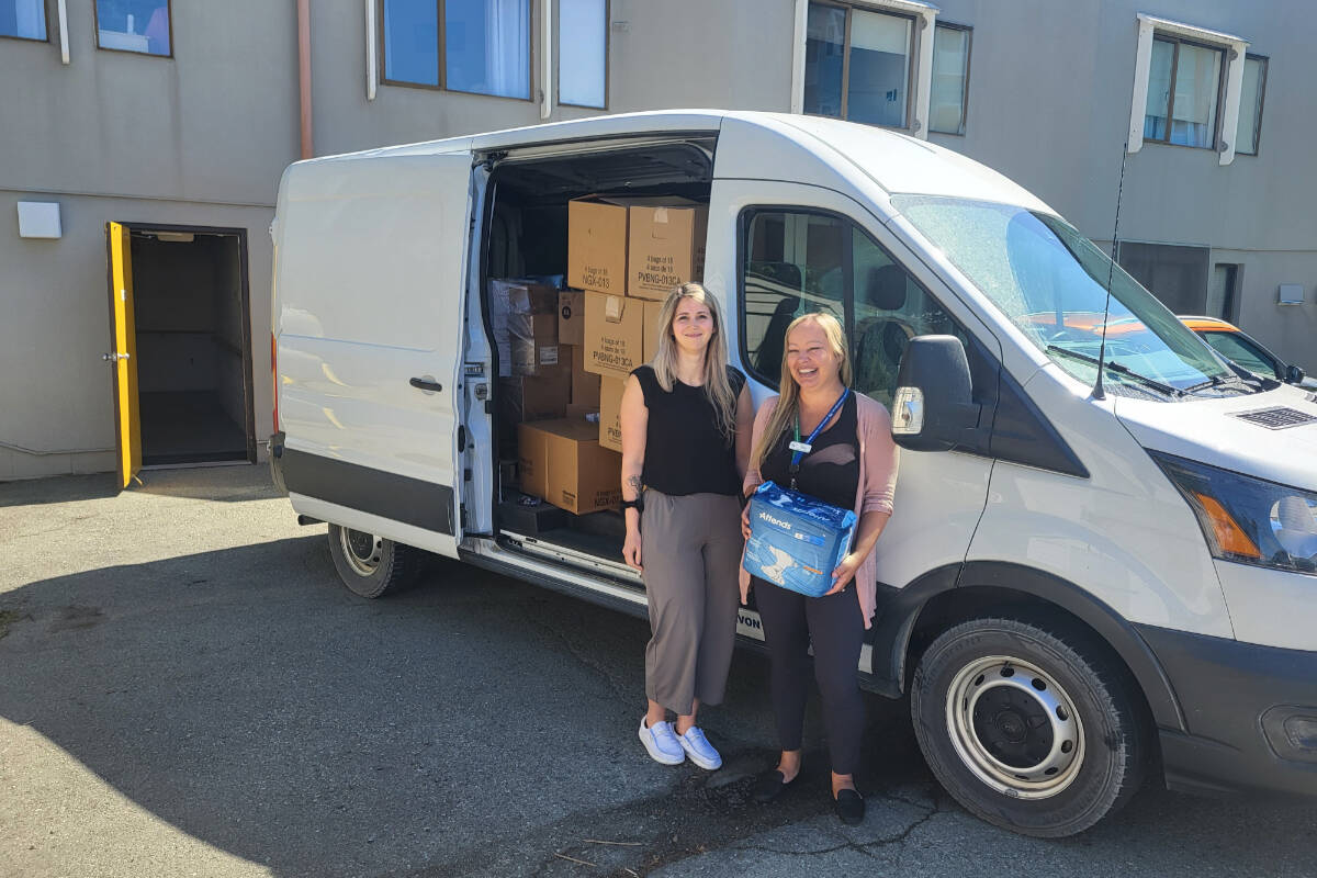 Tiffany Kubel, Assistant Director of Care, and Tara Jaworski, Director of Care for Fir Park Village and Echo Village stand beside a cargo van full of medical supplies that was delivered last week. (SUBMITTED PHOTO)