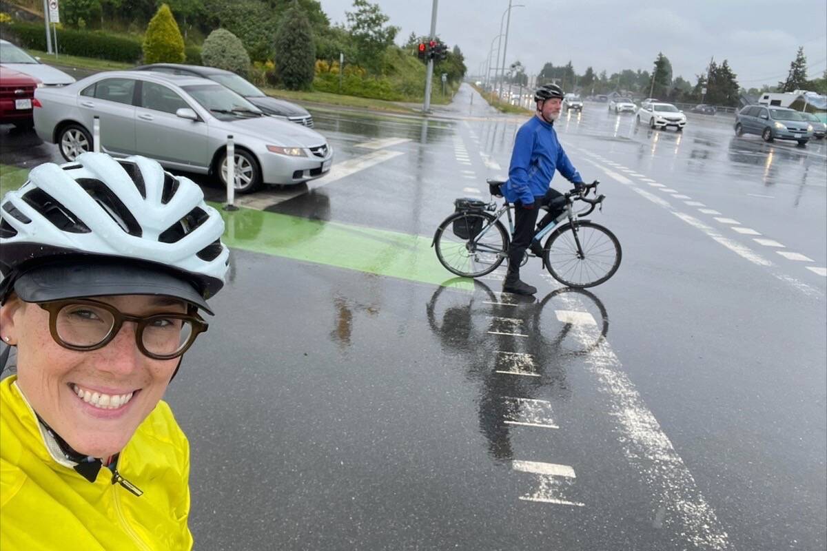 Andrew Appleton, GVPL board chair, and vice-chair Shahira Khair cycle nearly 70 kilometres to visit all 12 library branches on a rainy Saturday. (Courtesy GVPL)