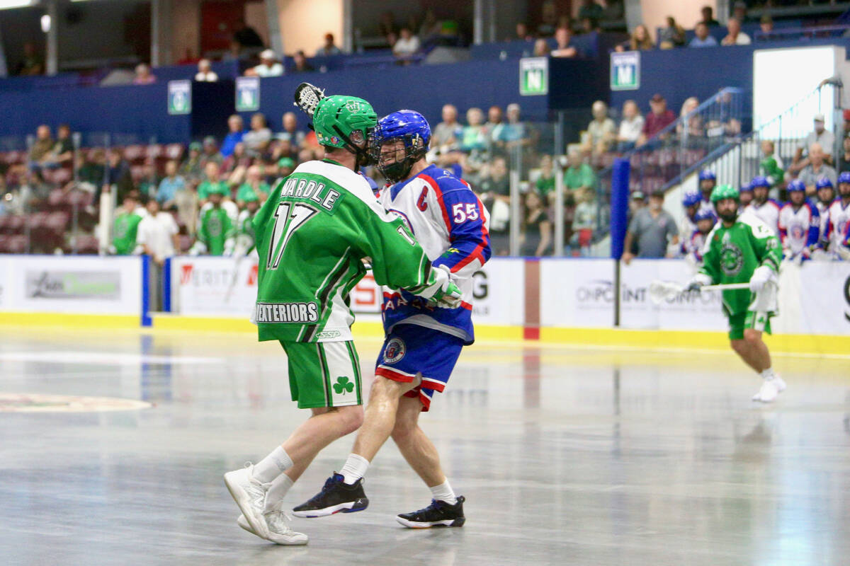 Chris Wardle, Victoria Shamrocks, and Anthony Kalinich of the Maple Ridge Burrards exchange words Friday, June 16 at The Q Centre. (Justin Samanski-Langille/News Staff)