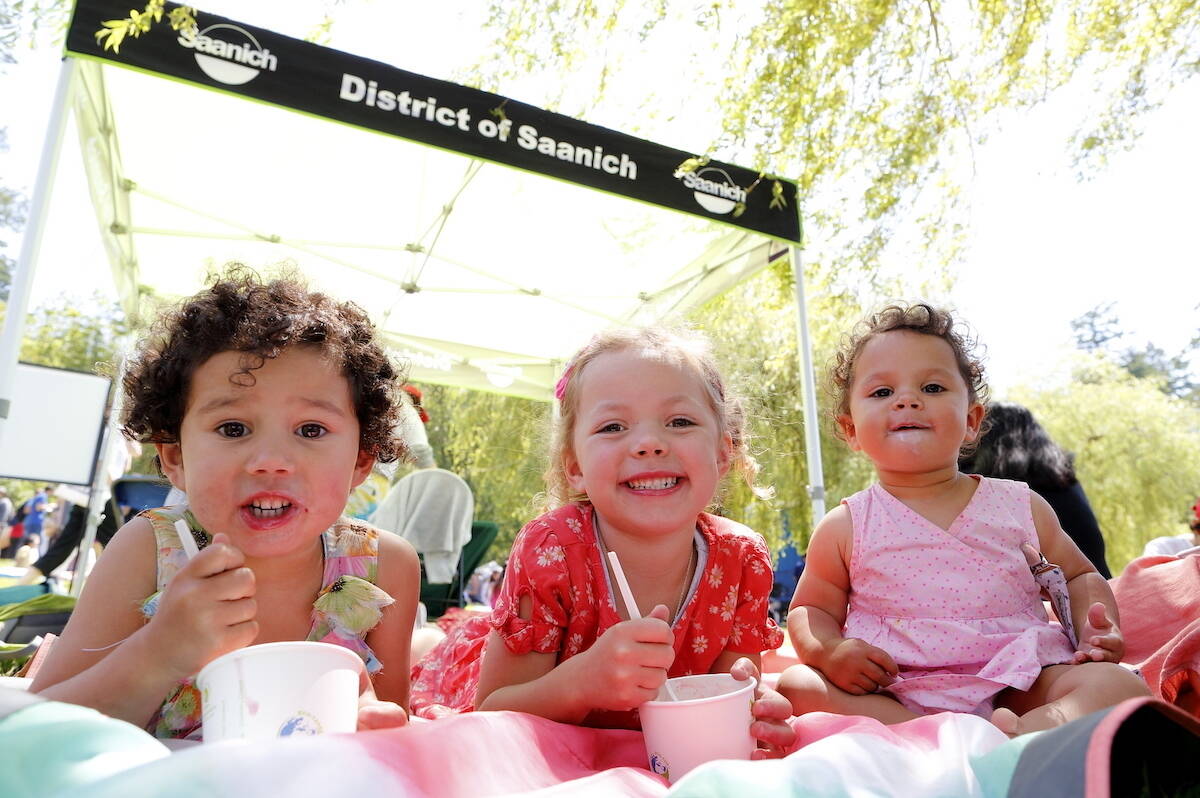 Three kids enjoy the staple of the Saanich Strawberry Festival: strawberry and ice cream (Contributed Kelsie McLeod).