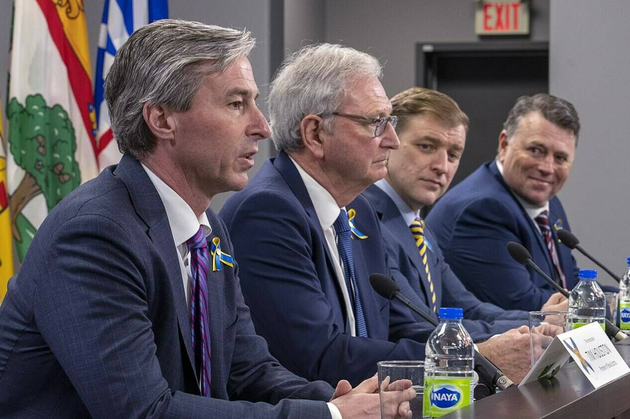 Nova Scotia Premier Tim Houston, New Brunswick Premier Blaine Higgs, Newfoundland and Labrador Premier Andrew Furey and Prince Edward Island Premier Dennis King, left to right, field questions at the closing news conference at a meeting of the Council of Atlantic Premiers in Halifax on March 21, 2022. THE CANADIAN PRESS/Andrew Vaughan
