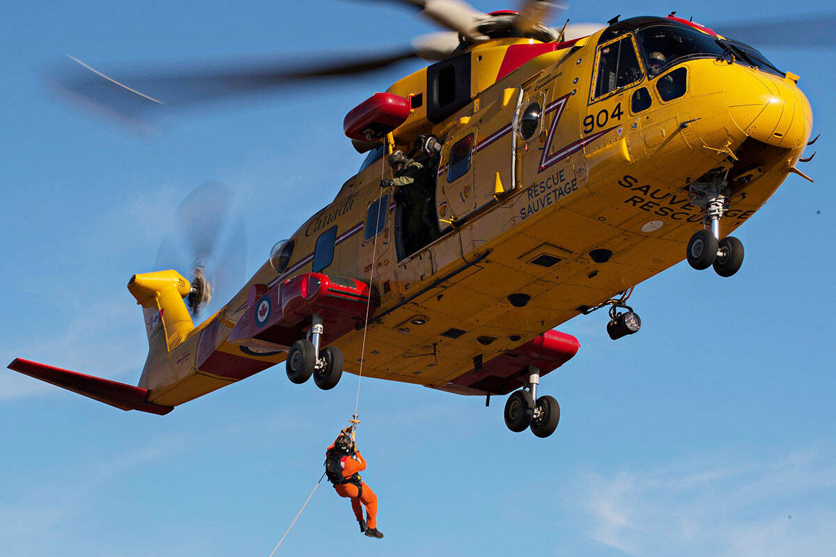A Cormorant helicopter was one of several Canadian and American aircraft and vessels which responded to a sinking yacht off Southern Vancouver Island Friday (June 30) night. Four people and a dog were rescued. (JRCC/ Twitter)