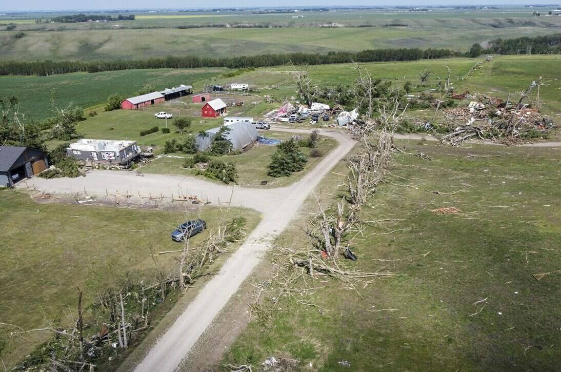 Tornado damaged homes are seen near Carstairs, Alta., Saturday, July 1, 2023. A day after a tornado destroyed Elisa Humphrey’s mobile home as well as another house on her property in central Alberta, a whirlwind of local helpers responded to her callout on social media for assistance cleaning up. THE CANADIAN PRESS/Jeff McIntosh