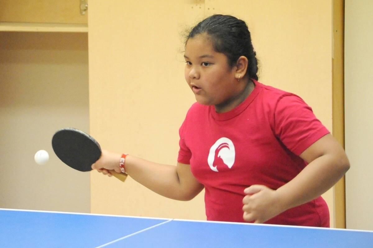 Ahva Trinidad, 9, is developing her table tennis game by competing against more seasoned players. (Michael Briones photo)