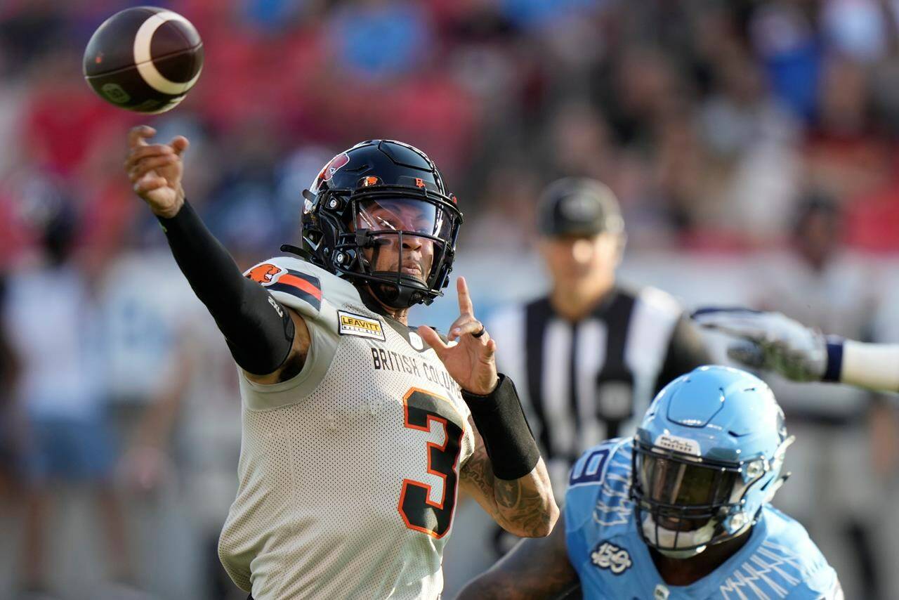 BC Lions quarterback Vernon Adams Jr. (3) throws under pressure from Toronto Argonauts defensive lineman Dewayne Hendrix (99) during first half CFL action in Toronto on Monday, July 3, 2023. Adams admits he made mistakes against the Argonauts, as the Lions lost for the first time this season, but he’s moving forward as the Lions prepate to host Montreal. THE CANADIAN PRESS/Frank Gunn