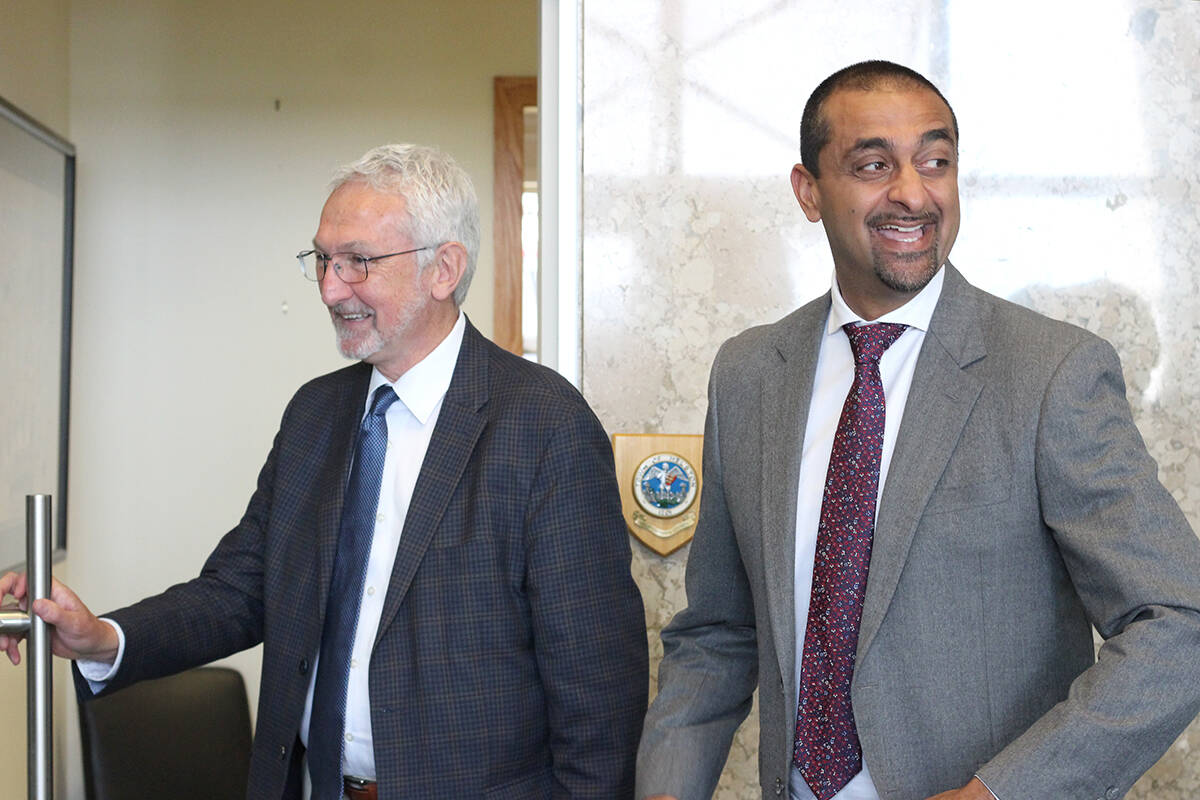Nanaimo Mayor Leonard Krog and B.C. Minister of Housing Ravi Kahlon have a laugh after a press conference at Nanaimo City Hall on Tuesday, July 4, following a meeting on housing. (Greg Sakaki/News Bulletin)