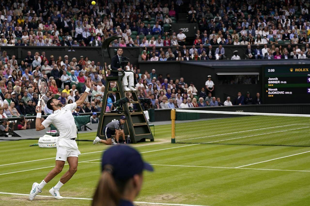 Serbia’s Novak Djokovic in action against Italy’s Jannik Sinner during their men’s singles semifinal match on day twelve of the Wimbledon tennis championships in London, Friday, July 14, 2023. (AP Photo/Alberto Pezzali)