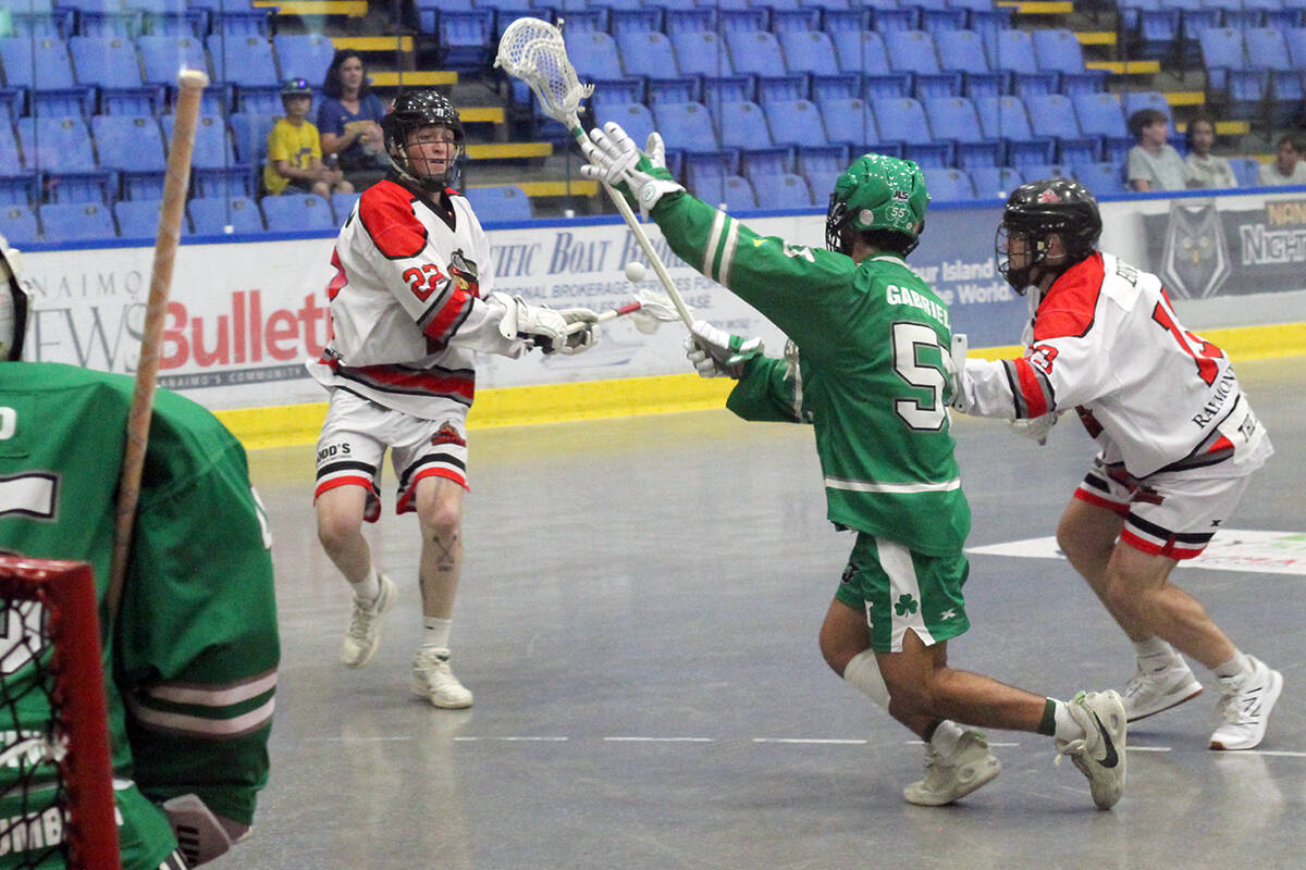 Junior A Nanaimo Timbermen player Ethan Kaban is defended by Victoria Shamrocks player Joshua Gabriele during BCJALL playoff action Friday, July 14, at Frank Crane Arena. (Greg Sakaki/News Bulletin)