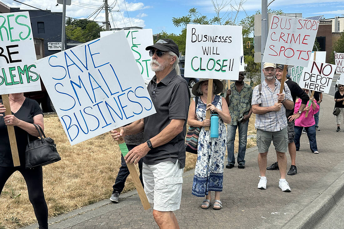 Citizens at a rally Sunday, July 16, protest the potential re-location of the downtown transit exchange. (Photo submitted)