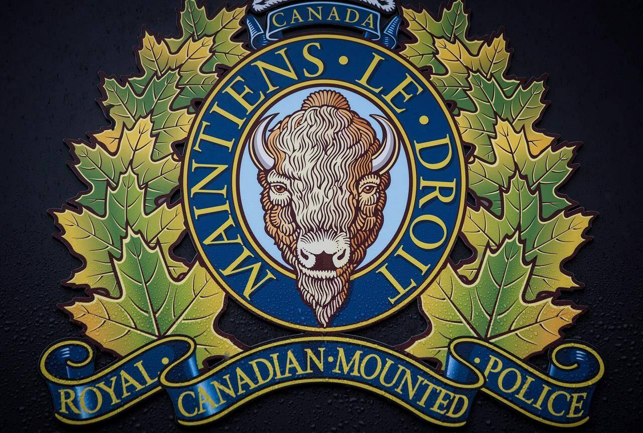 The RCMP logo is seen outside Royal Canadian Mounted Police “E” Division Headquarters, in Surrey, B.C., on Fri, April 13, 2018. THE CANADIAN PRESS/Darryl Dyck