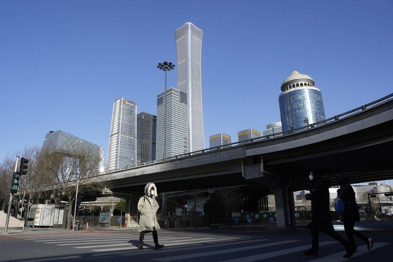 A newly released document shows intelligence officials have been tracking China’s attempts to meddle in Canadian affairs for more than one-third of a century. The February 1986 intelligence report warned that Beijing was using open political tactics and secret operations to influence and exploit the Chinese diaspora in Canada. A resident crosses a quiet street near the Central Business District skyline in Beijing, Tuesday, Dec. 13, 2022. THE CANADIAN PRESS/AP-Ng Han Guan