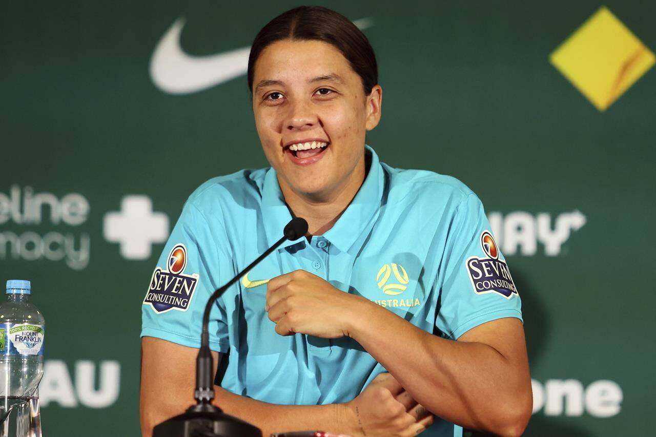 Australia’s Women’s World Cup captain Sam Kerr reacts during a press conference in Brisbane, Australia, Saturday, July 29, 2023. Kerr says she’ll be available for Australia’s must-win Women’s World Cup game against Olympic champion Canada after missing the team’s first two group games because of a calf muscle injury. THE CANADIAN PRESS/AP-Tertius Pickard