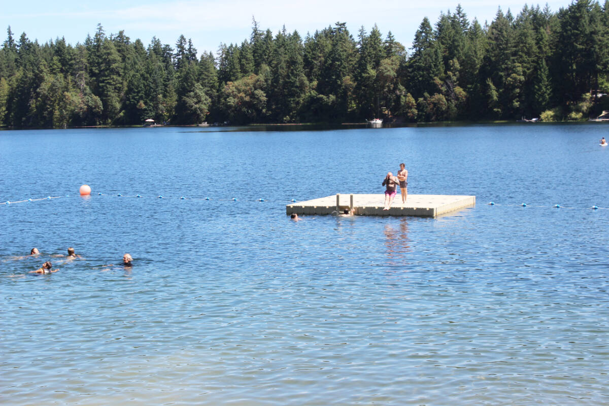 Swimmers at Fuller Lake Park during a predominantly sunny July. (Photo by Don Bodger)