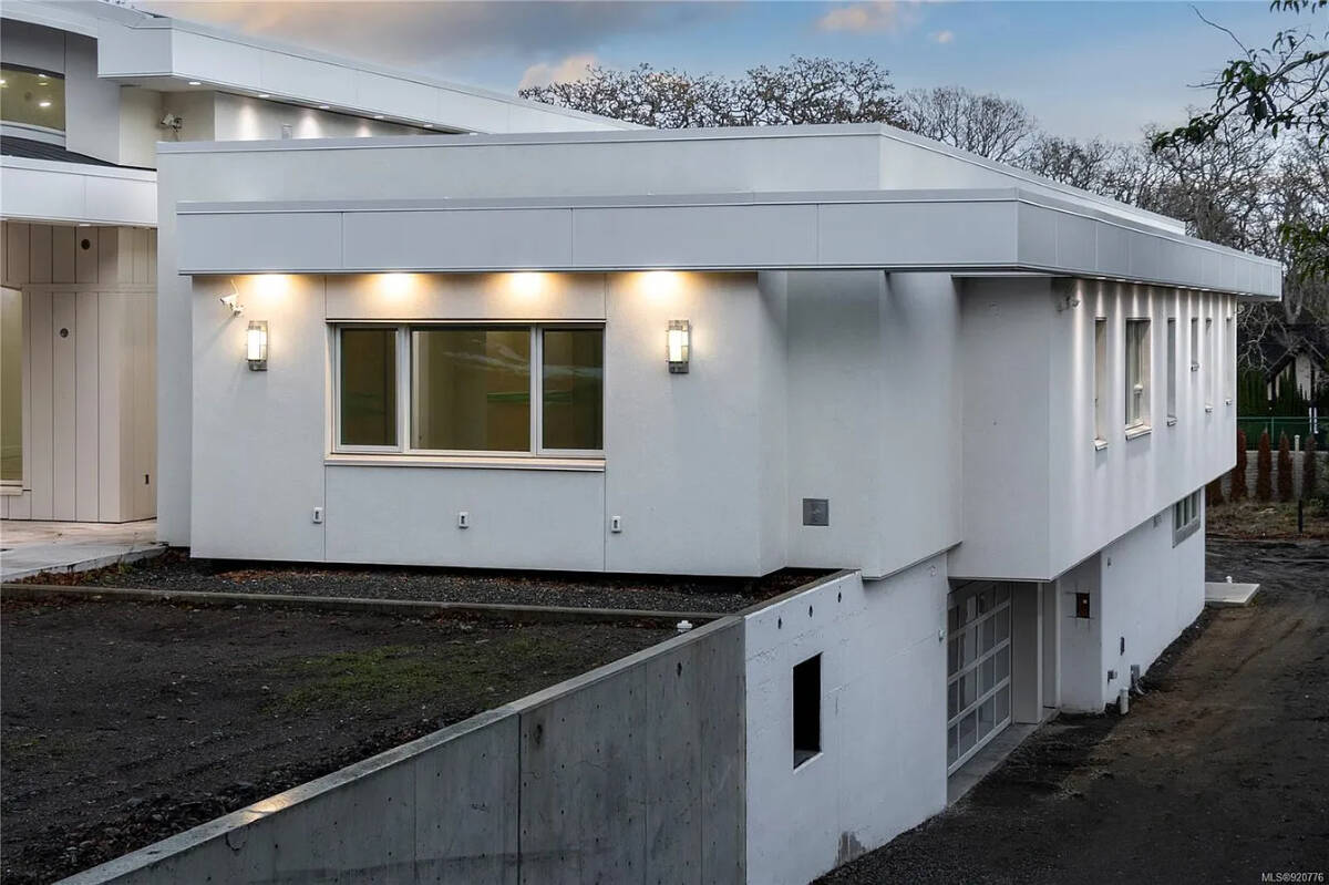 A house on Midland Road in Oak Bay has a lot going for it with five bedroom suites, 12 bathrooms, three kitchens and a turntable that rotates your vehicle in the garage. (Photo from Zillow)