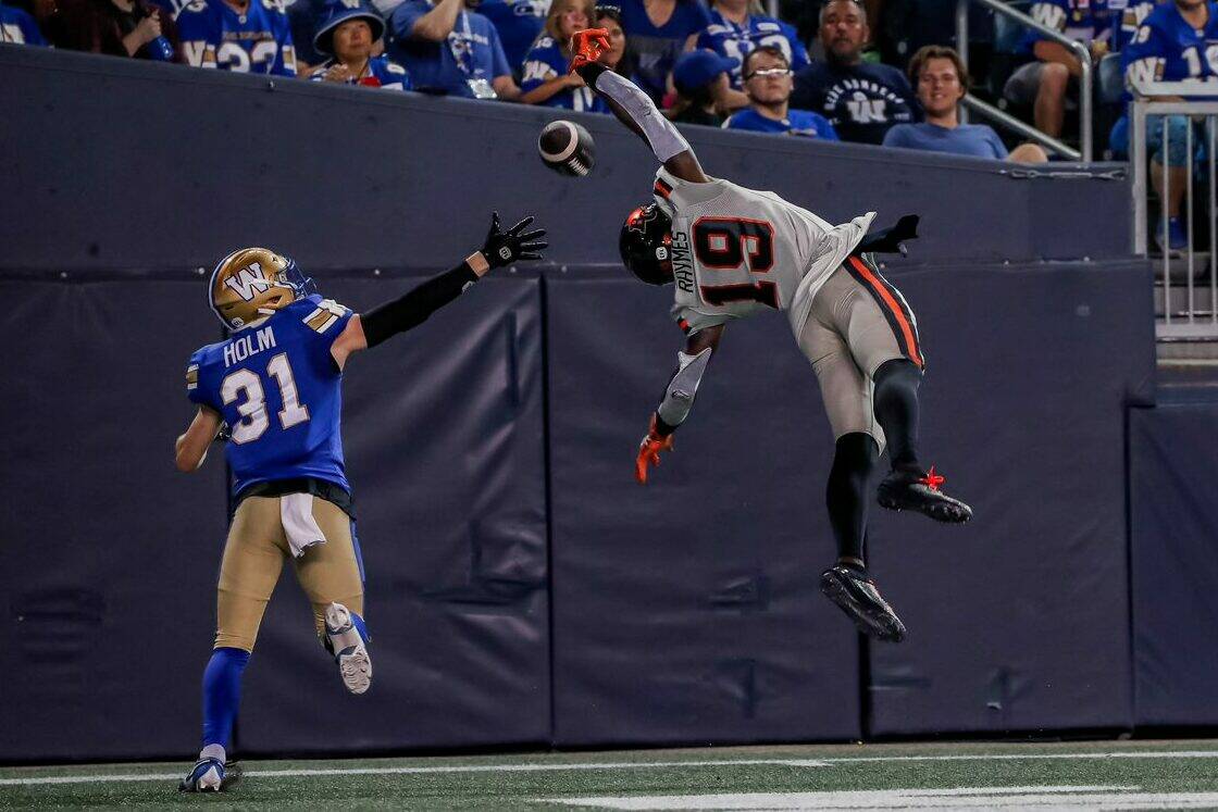 Lions receiver Dominique Rhymes (19) tries to haul in a pass in the end zone with Bombers halfback Evan Holm (31) in coverage. Holm and the Bombers would rout the Lions 50-14. Photo by Steven Chang, BC Lions