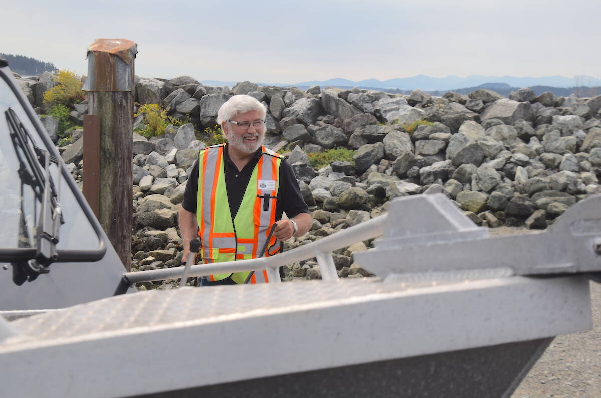 Volunteers with the Sidney Anglers Association, including Norman Kent, help people at the Tulista Park boat launch on weekends throughout the summer. (Brendan Mayer/News Staff)