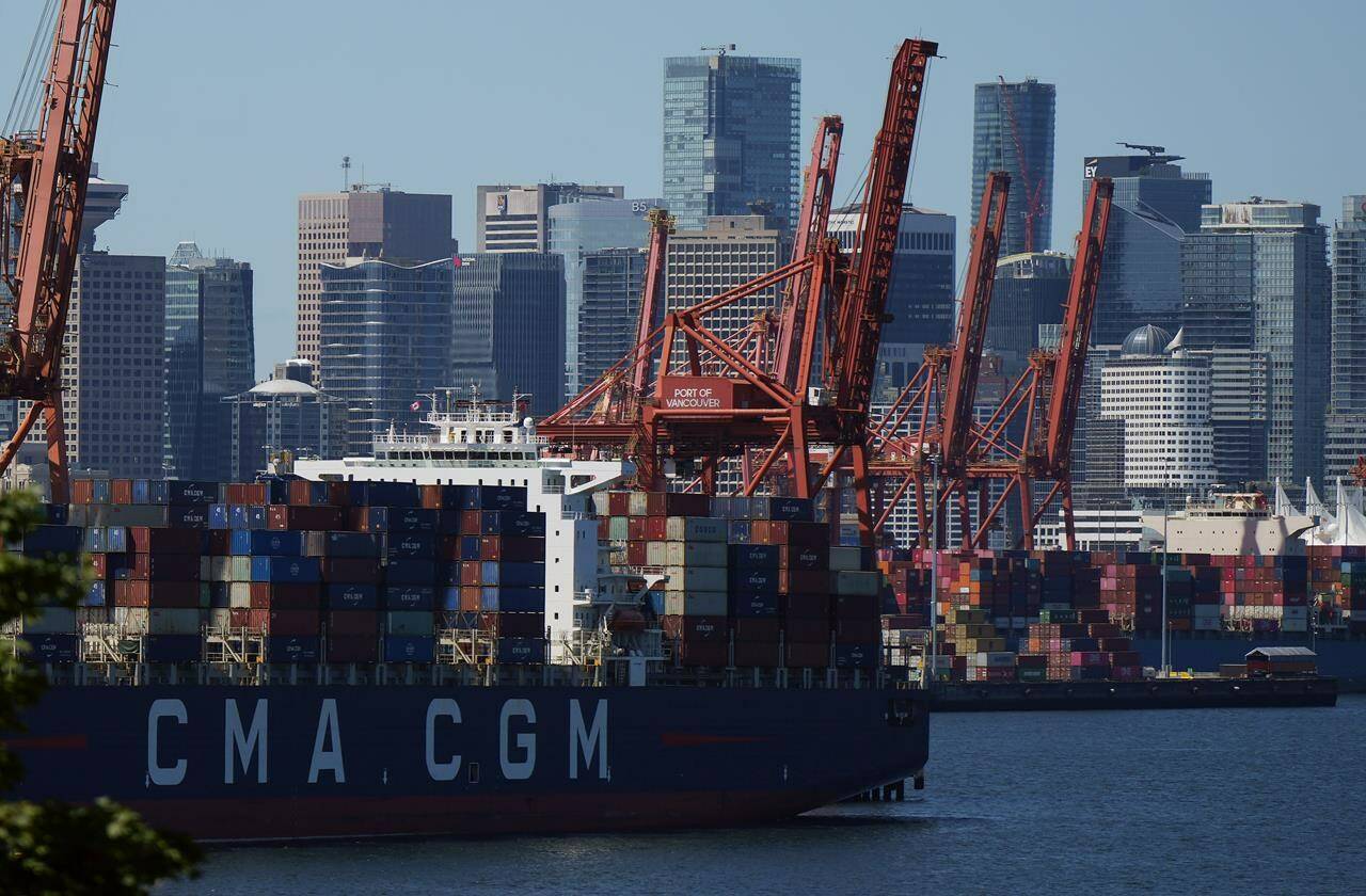 Gantry cranes sit idle as a container ship is docked at port during a work stoppage, in Vancouver, B.C., Wednesday, July 19, 2023. Federal Labour Minister Seamus O’Regan is launching an examination of the recently resolved British Columbia port dispute to see if “structural issues” in negotiations led to a 13-day work stoppage. THE CANADIAN PRESS/Darryl Dyck