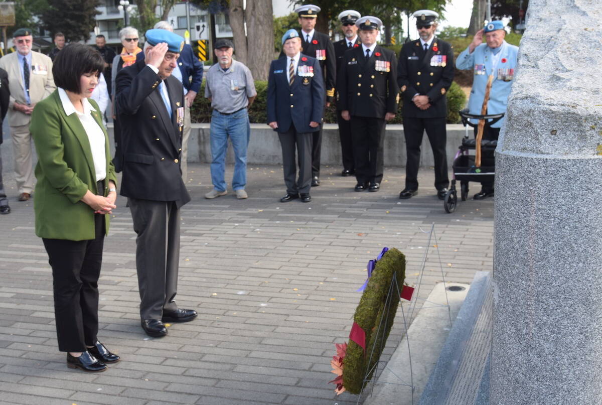 Veterans Affairs Minister Ginette Petitpas Taylor and Joseph ‘Larry’ Gollner, retired brigadier-general and president of the BC Afghanistan Memorial Society, lay a wreath at Victoria’s B.C. Afghanistan Memorial on National Peacekeepers’ Day. (Brendan Mayer/News Staff)