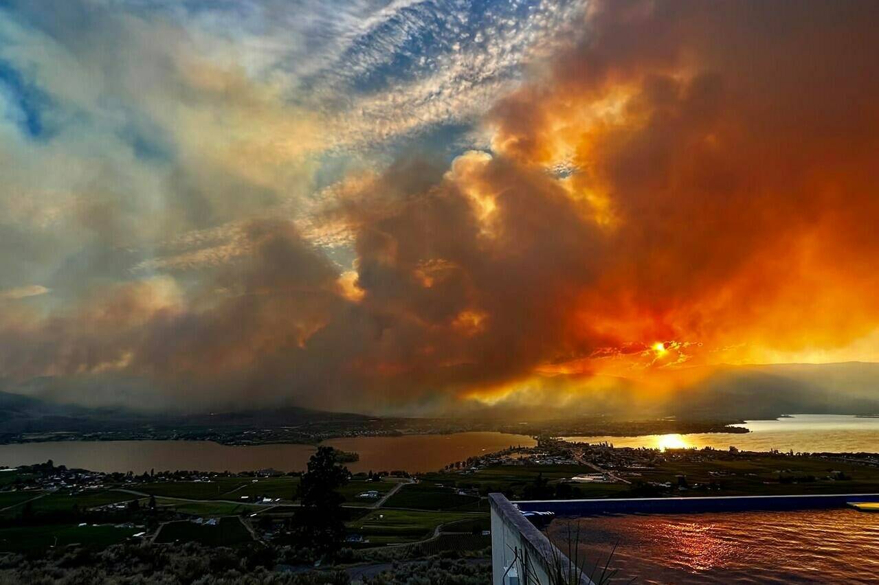 The Eagle Bluff wildfire is seen burning from Anarchist Mountain, outside of Osoyoos, B.C., in a Saturday, July 29, 2023, handout photo. All evacuation orders have now been lifted around the southern British Columbia community that saw a wildfire burn to its doorstep late last month as flames swept north across the border from Washington state.THE CANADIAN PRESS/HO-Melissa Genberg, *MANDATORY CREDIT*