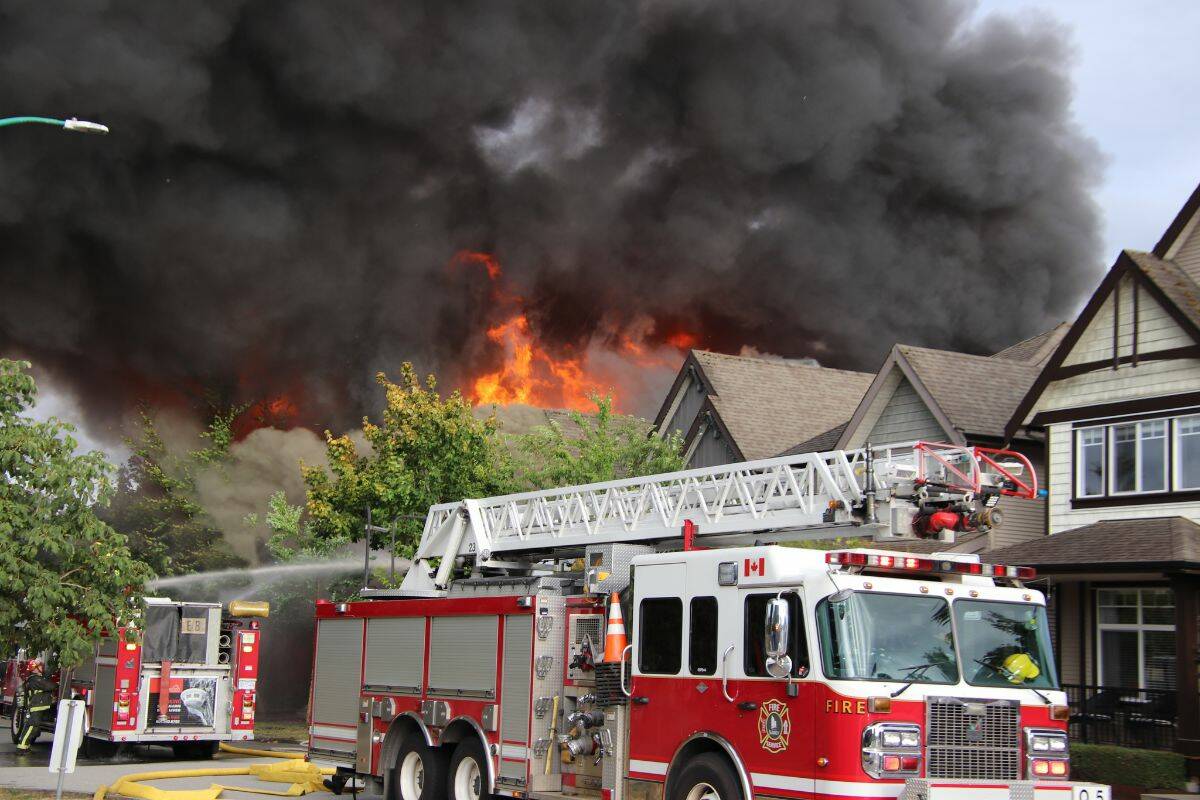 No injuries were reported after four houses went up in flames in Surrey Wednesday (Aug. 9). (Photo: Shane MacKichan)