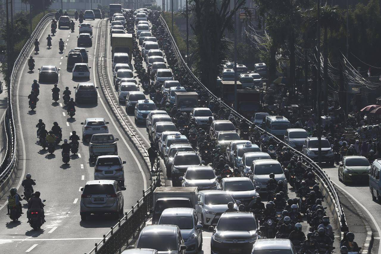 FILE - Vehicles are caught in a congestion during a rush hour in Jakarta, Indonesia, Thursday, Sept. 9, 2021. Indonesian authorities are blaming the dry season and and motorized vehicles as the main causes of air pollution in Jakarta, after a Swiss air quality technology company named the city as the most polluted in the world. (AP Photo/Achmad Ibrahim, File)