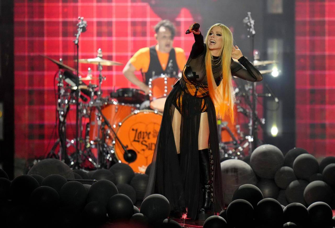 Avril Lavigne performs during the Juno Awards in Toronto on Sunday, May 15, 2022. Lavigne is among the five newly announced inductees to Canada’s Walk of FameTHE CANADIAN PRESS/Nathan Denette