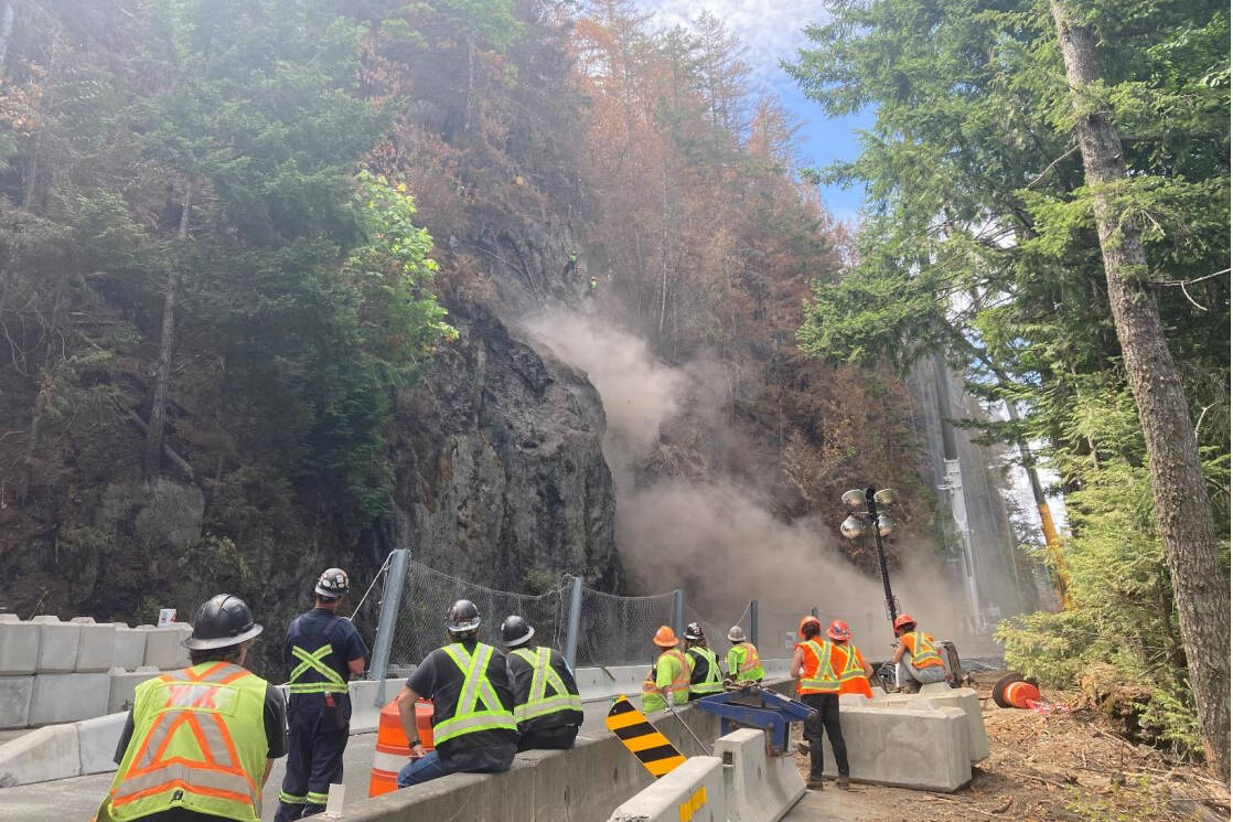 Scalers observe scaling from a safe distance on Highway 4. (PHOTO COURTESY BC MINISTRY OF TRANSPORTATION AND INFRASTRUCTURE)