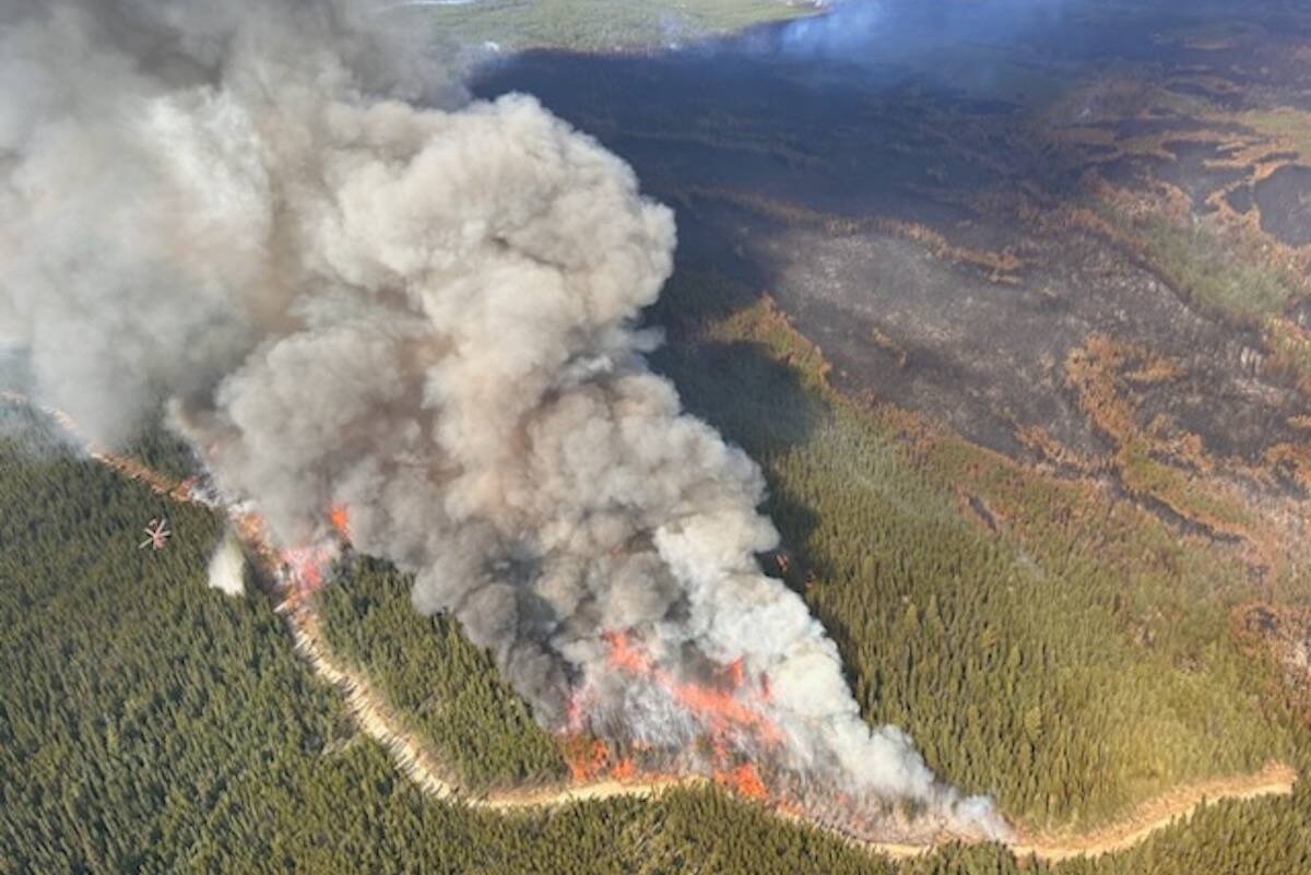 Fire crews are making process on the Ross Moore Lake wildfire despite a forecast of warmer temperatures. (BC Wildfire Services)