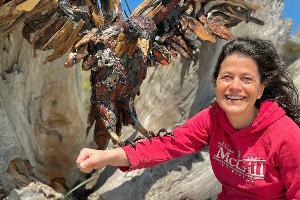 Artist Tanya Bub with driftwood sculpture. (Courtesy Tanya Bub)