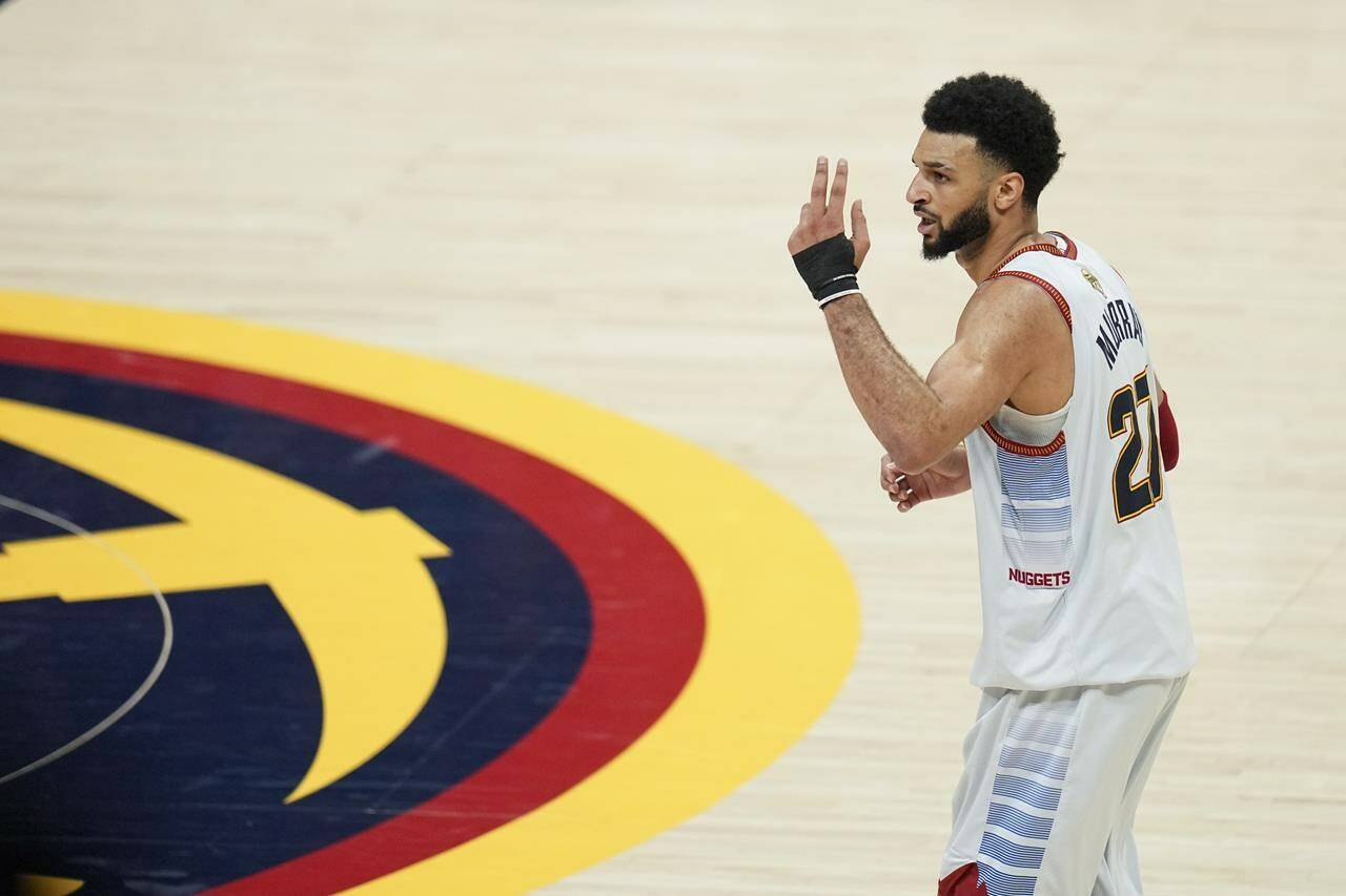 Denver Nuggets guard Jamal Murray gestures during the second half of Game 5 of basketball’s NBA Finals against the Miami Heat, Monday, June 12, 2023, in Denver. Murray will not suit up for Canada in the upcoming FIBA World Cup, Canada Basketball announced on Wednesday.THE CANADIAN PRESS/AP/Jack Dempsey
