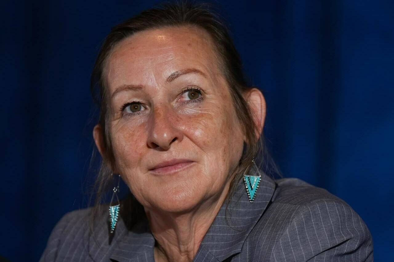 Northwest Territories Premier Caroline Cochrane listens during a news conference after a meeting of Western Premiers in Whistler, B.C. on Tuesday, June 27, 2023. Cochrane was a social worker before entering politics, so when the territory’s capital ordered everyone to leave last week due to encroaching wildfires, she said she checked to make sure homeless people weren’t forgotten. THE CANADIAN PRESS/Darryl Dyck