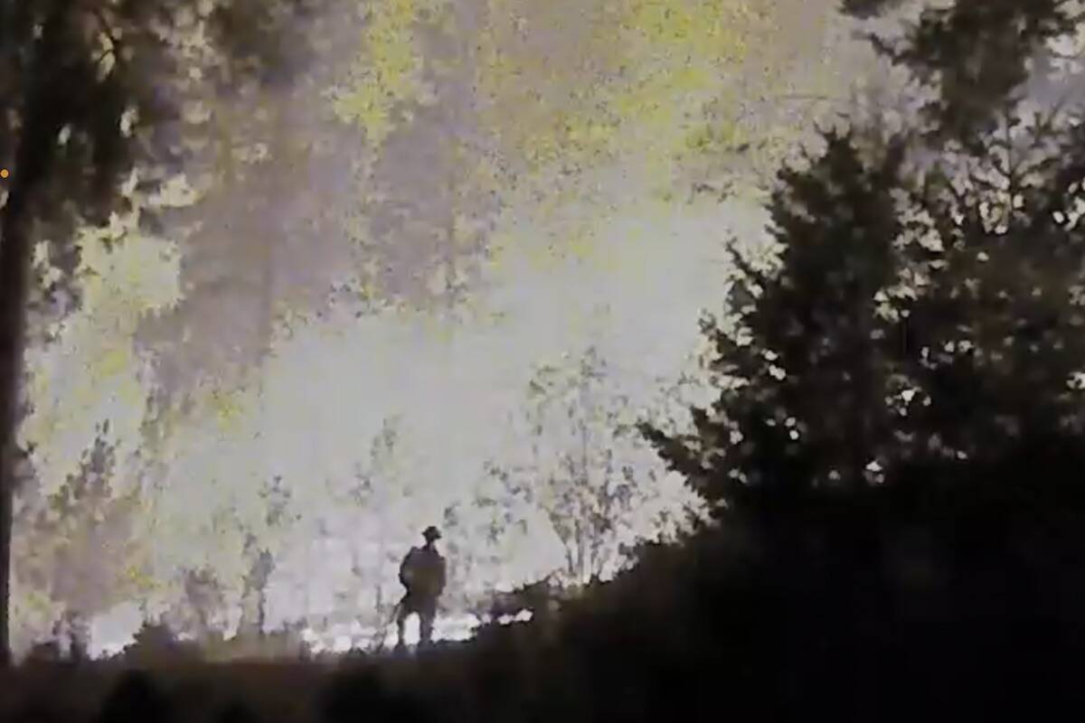 A lone firefighter stayed behind at Pettman Road to save structures threatened by the McDougall Creek fire. (contributed)