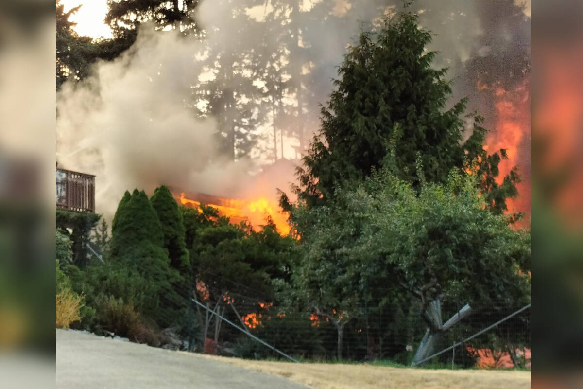 A house on Dolphin Drive in Nanoose Bay was destroyed by a fire the evening of Aug. 20. (Photo courtesy of Ken Humphreys)