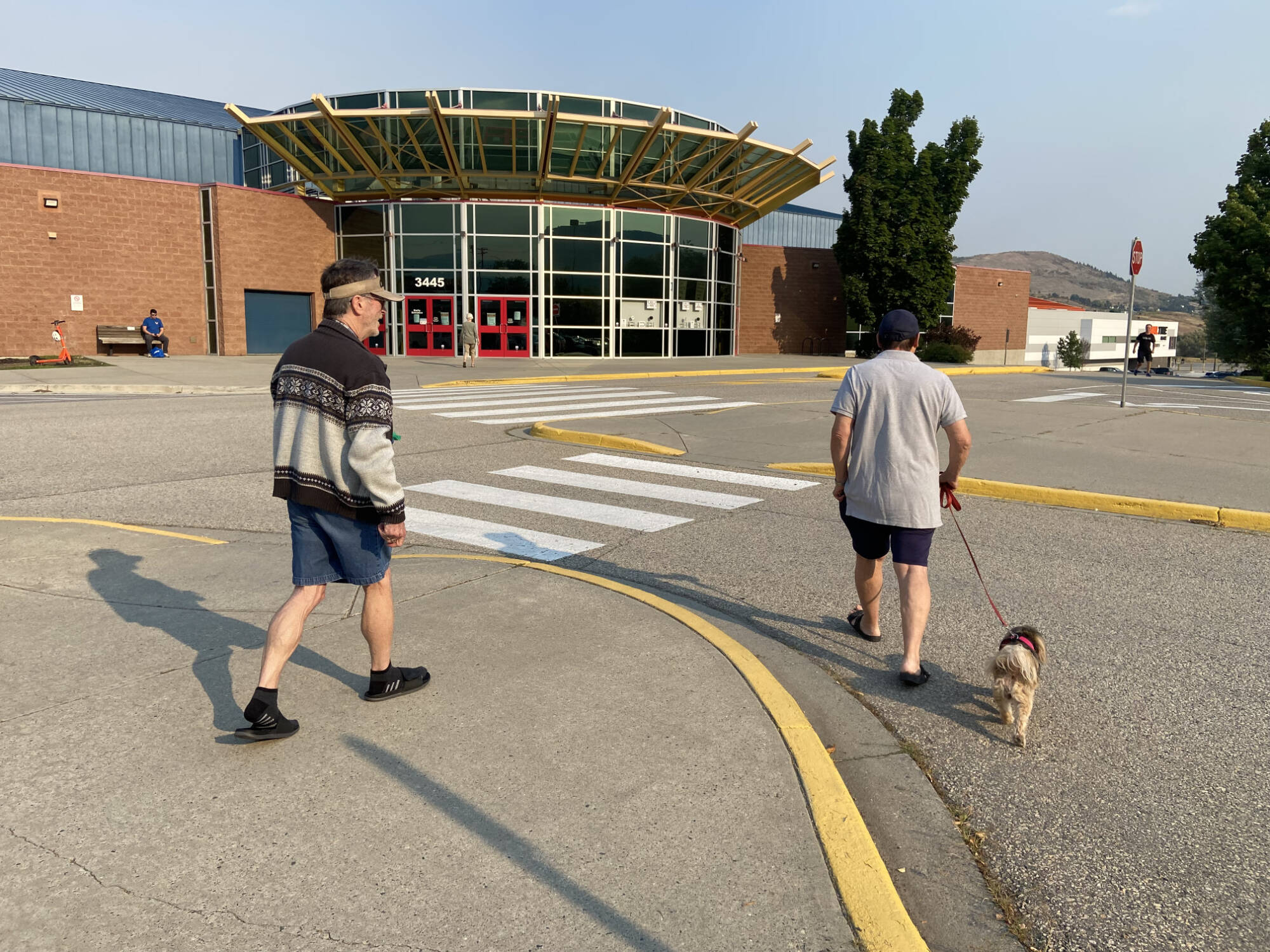 Fintry residents Real Gousy, Rick Walker and Elsa check in at the Emergency Support Services reception centre at Vernon's Kal Tire Place Friday after being evacuated. (Jennifer Smith - Morning Star)