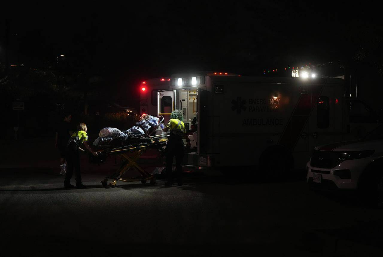 Nearly 900 seniors have been forced out of care facilities in a wildfire-ravaged region of British Columbia while the province has joined Alberta in receiving medical evacuees from the Northwest Territories, from where thousands of residents have escaped dangerous conditions. A resident is placed in an ambulance as paramedics assist in the evacuation of a seniors care facility due to wildfires, in Kelowna, B.C., Friday, Aug. 18, 2023. THE CANADIAN PRESS/Darryl Dyck