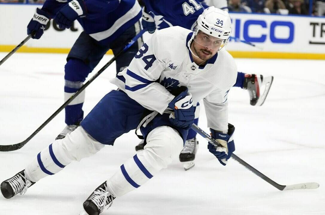 FILE - Toronto Maple Leafs center Auston Matthews (34) reacts after scoring against the Tampa Bay Lightning during the third period in Game 4 of an NHL hockey Stanley Cup first-round playoff series on April 24, 2023, in Tampa, Fla. The Maple Leafs signed star center Matthews to a four-year deal, $53 million contract extension on Wednesday, Aug. 23, 2023. (AP Photo/Chris O’Meara, File)