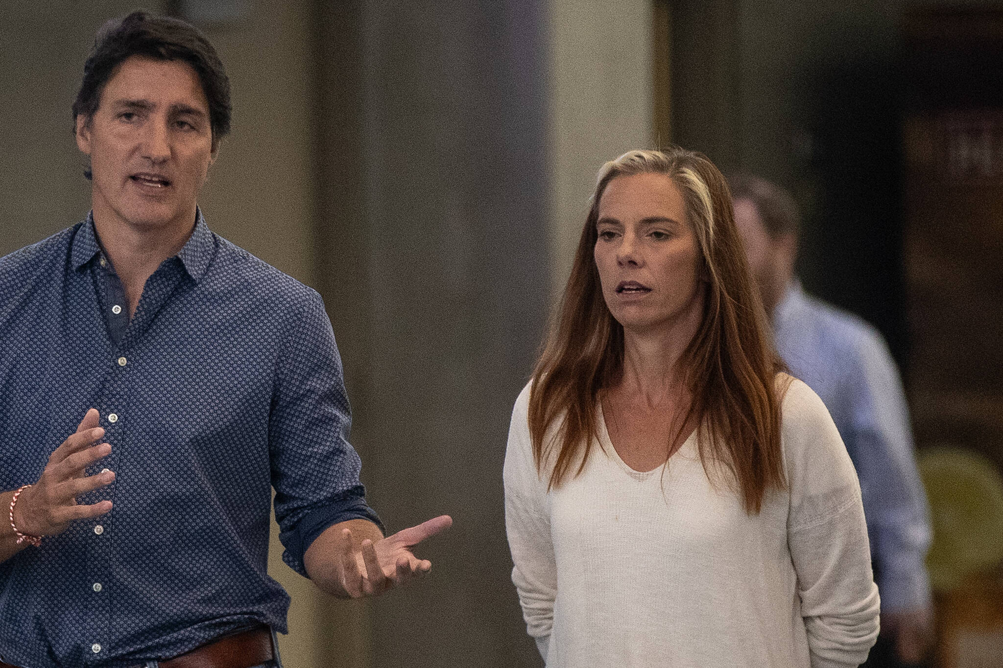 Prime Minister Justin Trudeau and Minister Caroline Wawzonek walk to a press conference to speaks on the wildfires in B.C. and the Northwest Territories after visiting evacuees in Edmonton, Friday, Aug. 18, 2023. THE CANADIAN PRESS/Jason Franson