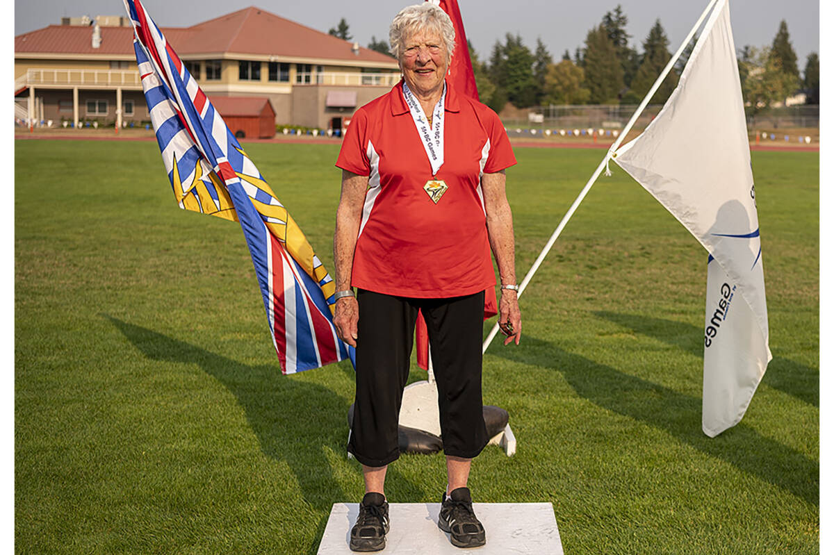 Myrtle Acton receives a gold in discus throw at the Abbotsford 55-Plus BC Games. She set an unofficial world record for her age group at the event. (Paul Funk photo)