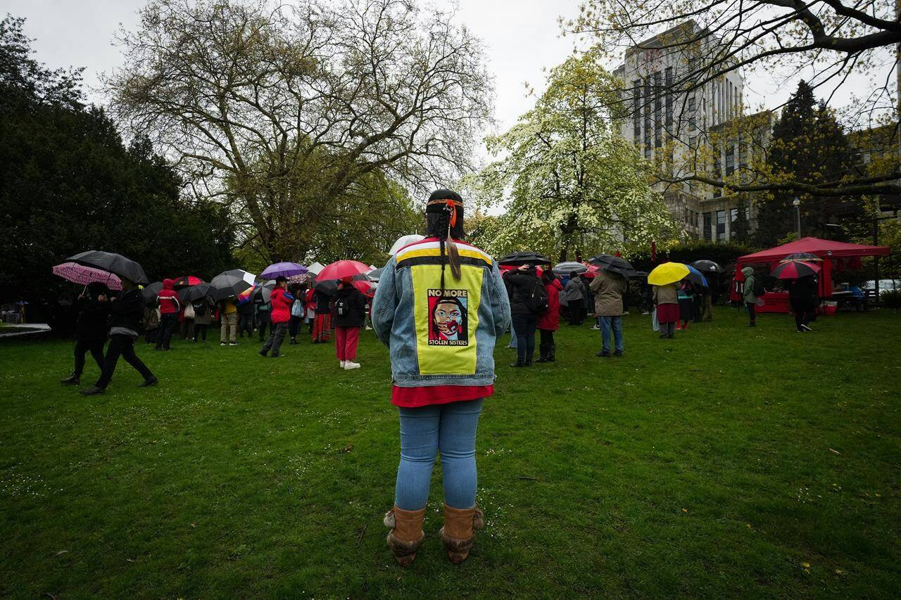 People attend a Red Dress Day ceremony marking the National Day of Awareness for Missing and Murdered Indigenous Women, Girls, and Two-Spirited people in Canada, in Vancouver, B.C., Thursday, May 5, 2022. Racism and the lack of primary care providers mean off-reserve First Nations, Métis and Inuit females have poorer health overall compared to their non-Indigenous counterparts, says a study by the Public Health Agency of Canada.THE CANADIAN PRESS/Darryl Dyck