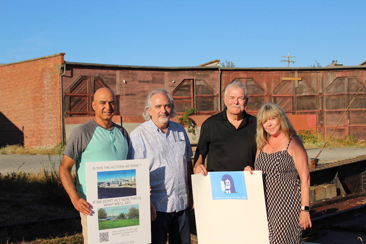 Victor Mattu, Arthur McInnis, Don Gordon and Linda Casano from the People for Sensible Rezoning group stand in front of the Roundhouse buildings in Vic West. (Natasha Baldin/News Staff)